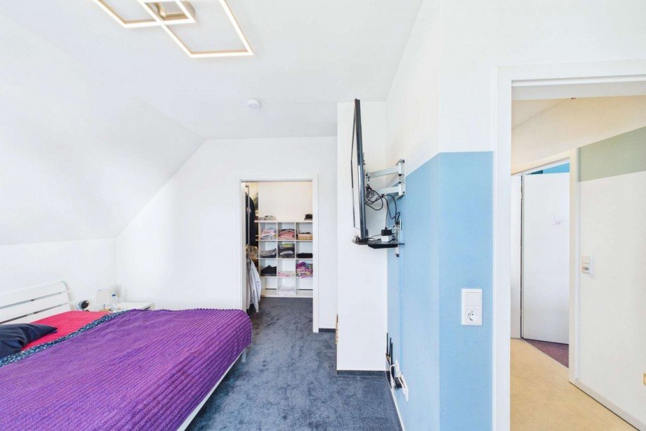 Elternschlafzimmer im Obergeschoss mit Ankleidezimmer Einfamilienhaus Bergfeld